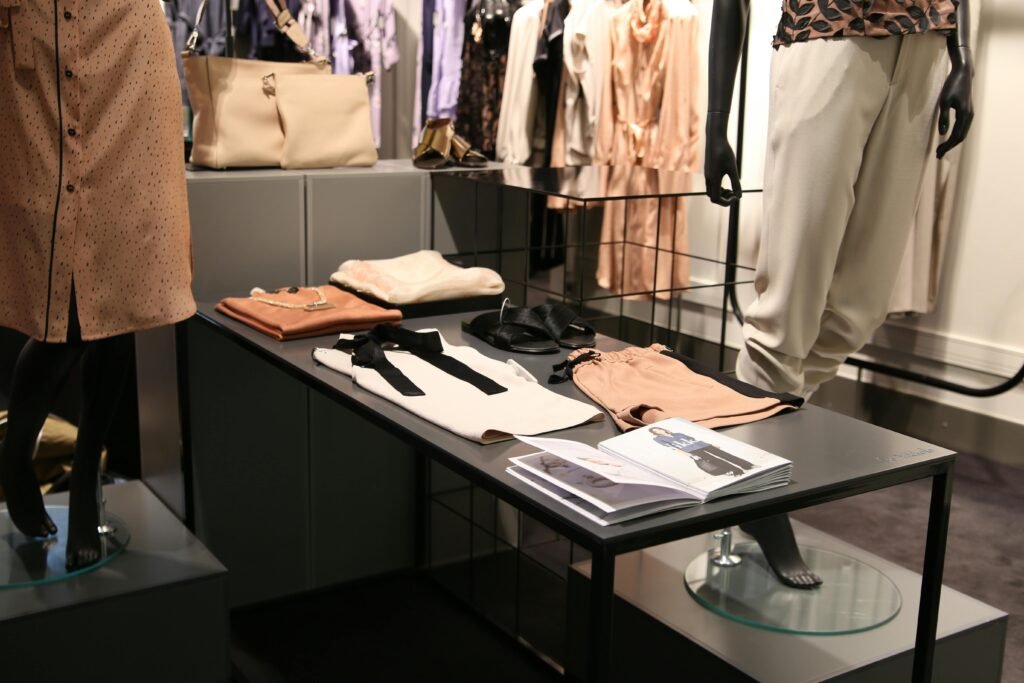 Stylish fashion display with curated pieces, mannequins, and a lookbook