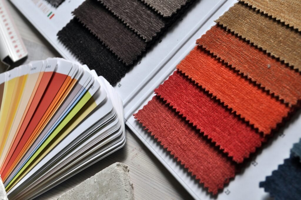The color swatches and fabrics are on the desk.